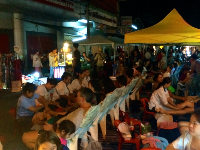 These are Thai massage chairs, lining the open streets for anyone to enjoy a quick foot rub